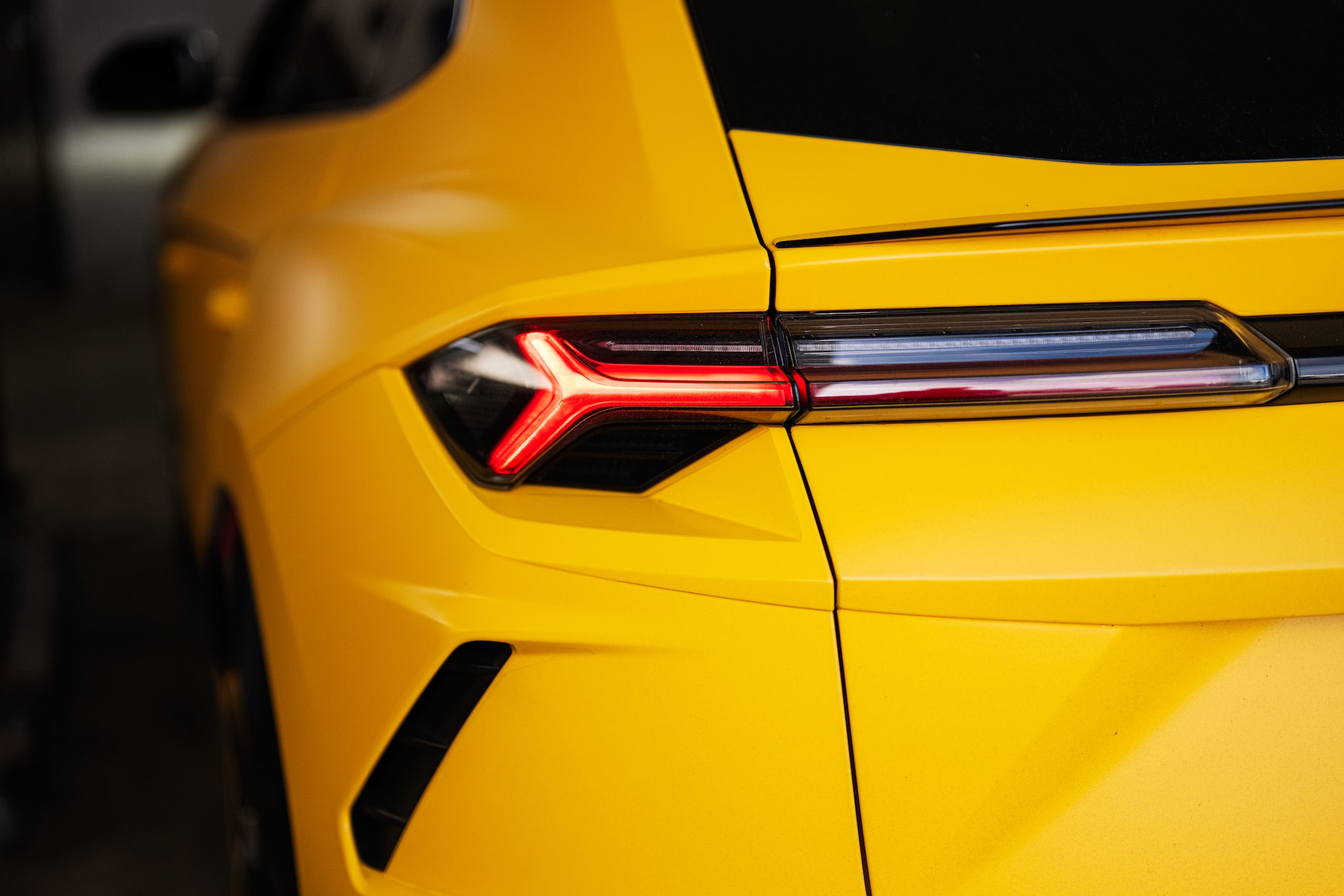 Back lights of yellow sport car suv.